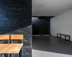 A modern lobby with concrete and stone materials.