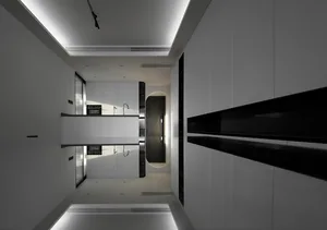 A modern, white-rendered kitchen design