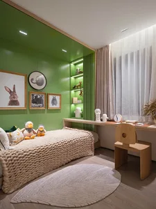 A minimalist children's bedroom featuring a green paneling accent wall, a wooden desk, a bed with a beige blanket, and variou