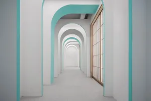 A modern corridor with arches and a concrete floor.