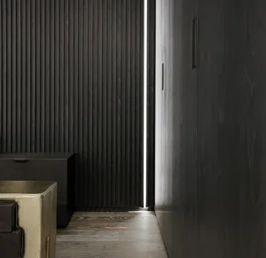 A modern interior space featuring dark wooden panels and minimalist design.