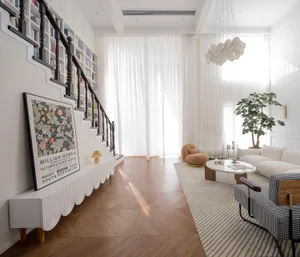 A modern living room featuring a herringbone-patterned floor and white curtains, creating a bright and spacious atmosphere.