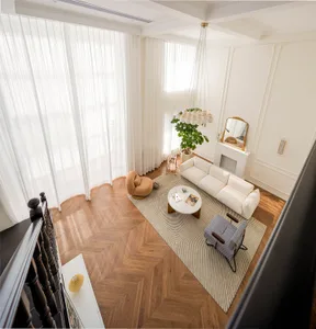 Modern minimalist living room featuring a white sofa, a brown accent chair, and a round coffee table on a striped rug, with a