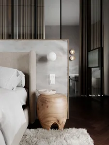 A minimalist bedroom showcasing a marble wall and wooden furniture.
