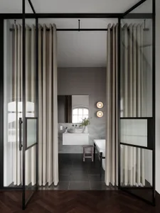 Modern bathroom with glass and marble finishes