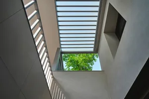 Modern interior with glass wall and skylight