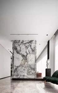 Modern living room featuring marble walls and floor, minimalist decor, and large windows.