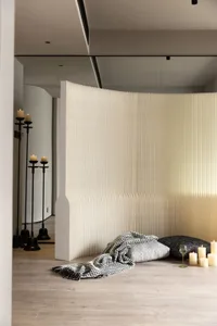 Modern living space featuring textured canvas backdrop and ambient lighting