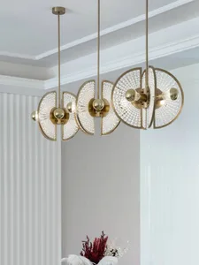 Modern interior design featuring a brass and glass chandelier.