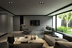 A modern minimalist living room with grey concrete walls, a large window, and contemporary furniture.