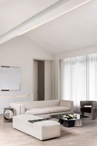 A minimalist living room with white leather furniture, a glass coffee table, and white curtains.