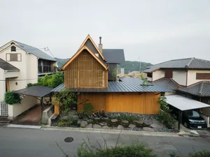 A modern residential house with wood and metal exterior features.