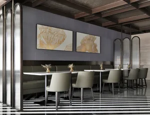 Modern restaurant interior featuring black, white, glass, and metal elements.