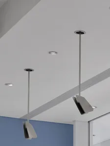 A clean and minimalistic space with suspended lights as the main focus