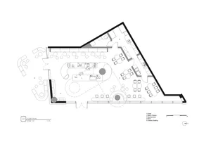 A modern floor plan with multiple tables and chairs in a spacious open area