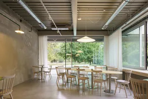 A warm and inviting dining area with a wooden table and metal chairs, perfect for a relaxed meal