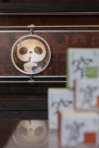 A store display featuring a collection of boxes on a wooden table, creating an organized and visually appealing presentation