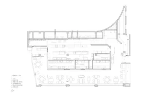 A large empty room with twelve chairs in various positions, creating a spacious and inviting atmosphere