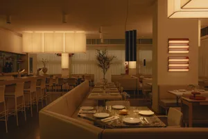 Sophisticated dining space with wooden accents, potted plants, and fine dining setup