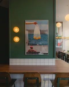 A cozy restaurant dining area with a wooden table and chairs, creating a warm and inviting atmosphere