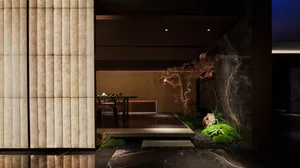 A well-lit dining area with a wooden table surrounded by chairs, creating a cozy atmosphere for socializing and enjoying meals together