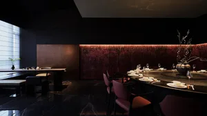 Formal dining area with a long wooden table and chairs, wine glasses, and a sophisticated atmosphere