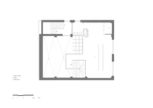 Empty minimalist room with a few pieces of furniture, including two chairs and a dining table, in a clean and minimalistic atmosphere