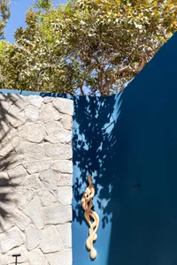 A wooden sculpture attached to a wall, adding character and creativity to the space