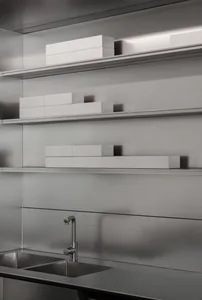A silver metal shelf filled with boxes of varying sizes, placed on different levels, creating an organized and tidy appearance in a clean and well-maintained storage area