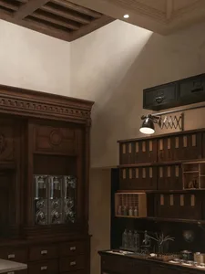 A dimly lit room with a vintage wooden cabinet and bottles, creating a cozy and nostalgic atmosphere