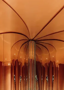 A modern hallway with a curved ceiling, mirrors on the walls, and various lights creating a sense of depth and ambiance