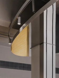 Modern lobby with a metal staircase, two side lights, and a contemporary design