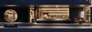 An inviting bar area with a black countertop, chairs, and natural light from a large window