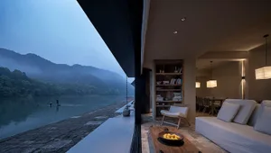 Cozy open concept living area with couches, a chair, and a coffee table with fruits, set against a warm and inviting atmosphere