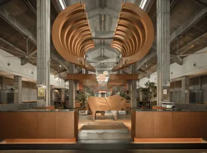 A large wooden sculpture dominates the interior of a building with a focus on artistic expression and appreciation