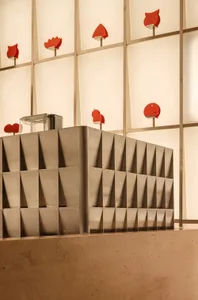 A silver structure with multiple shelves and compartments, adorned with red hearts, creating a unique and eye-catching atmosphere