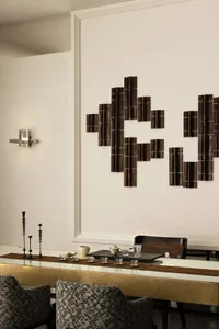 A well-lit interior space with a wooden wall art piece and decorative cups, creating a warm and inviting atmosphere