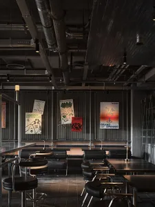 A cozy dining area with multiple tables and benches, providing ample seating for guests in a relaxed atmosphere