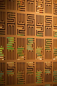 Abstract geometric design featuring a pattern of squares and rectangles in a modern space with wood and metal elements