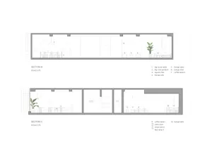 Architectural drawing of a restaurant interior with a kitchen, dining area, and bar, featuring textual information and diagrams, well-lit with natural light