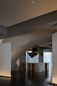 Spiral staircase made of marble, stone countertop, and elegant design elements in a sophisticated living space