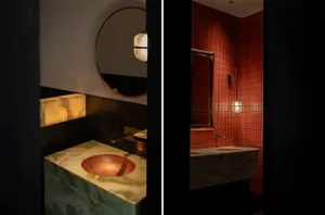A bathroom with two sinks, two mirrors, and multiple lights in a modern setting