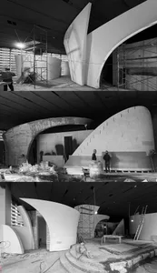 Construction site with workers in various stages of building a structure, with people standing near walls, stairs, and a large structure