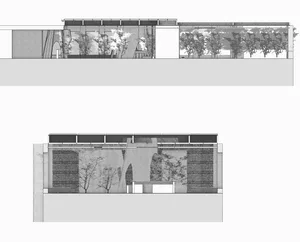 A modern building with a glass and concrete facade, surrounded by trees, featuring multiple windows and a contemporary architectural style