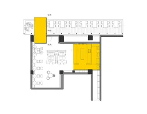 A modern interior space with yellow walls and floors, featuring chairs and dining tables in a large open area
