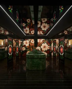 Ornate bathroom with a large stone sink and floral patterned walls, dimly lit for a cozy atmosphere