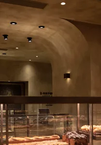 A cozy dining area in a Chinese restaurant with multiple tables and chairs, creating a welcoming atmosphere for guests