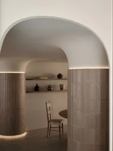 A cozy dining area with a wooden table surrounded by modern chairs, inviting for gatherings and meals