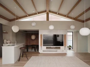 Open living area with a large TV, wooden floors, neutral tones, and potted plants
