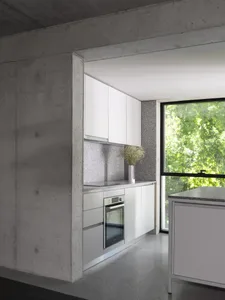 Modern kitchen with white cabinets, a window, and a sink, with two vases on the countertops